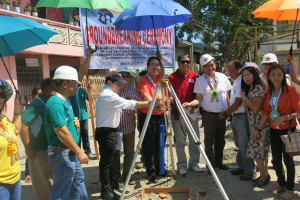 Cong. Rufus B. Rodriguez leads the capsule laying ceremony for the road concreting project in Brgy. Lapasan
