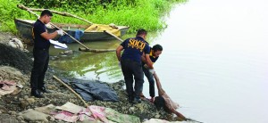 Dead man with over 50 knife wounds found floating under bridge