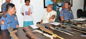 Police nab man wanted for murder, seize guns