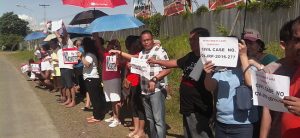 Homeowners picket against cemetery in residential area