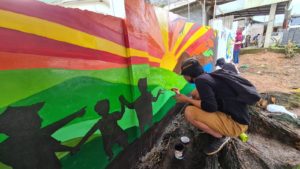 Painting murals gives parents, teachers, youth an empowering role for promoting peace