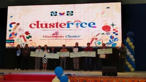 Winners of the 2025 Regional Invention Contest and Exhibits (RICE) Mindanao Cluster holding ceremonial checks for P25,000 and P50,000 during the awarding ceremony.