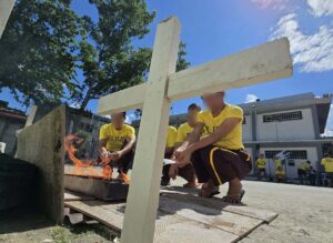 Iligan City Jail inmates light candles for loved ones in special memorial park