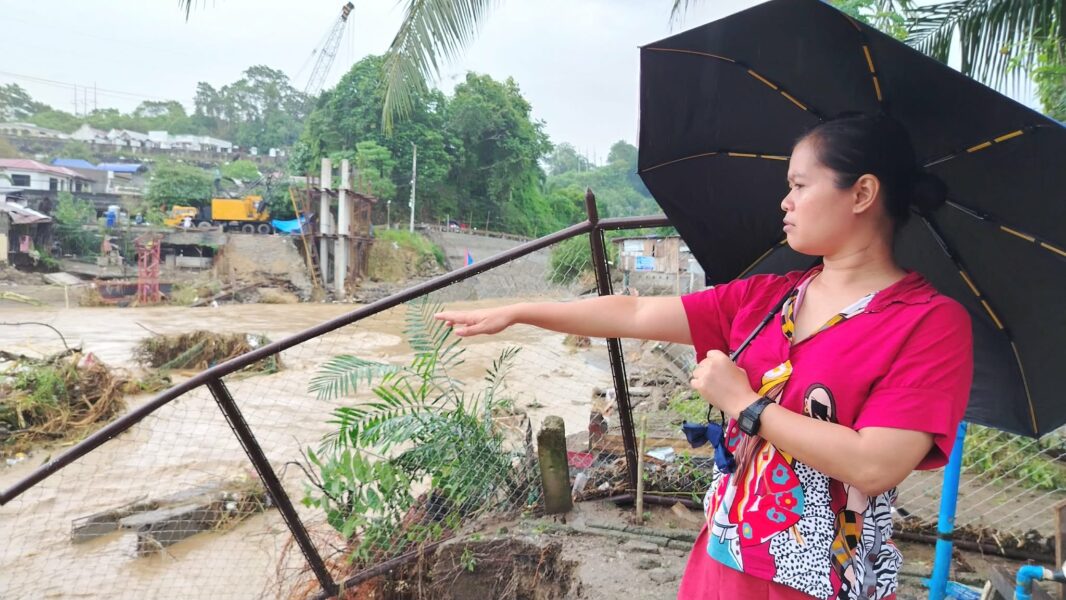 Residents of Barangay Pala-o, Iligan City, wade through knee-deep floodwaters caused by Tropical Typhoon Basyang, forcing families to evacuate overnight. "We just rebuilt our lives after the fire, and niw this happen again," said resident Gee Collantes, as flooding and damaged infrastructure cut off access to essential services. (Photo by Bonita L. Ermac)