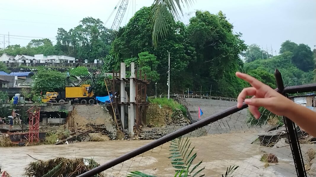 Residents of Barangay Pala-o, Iligan City, wade through knee-deep floodwaters caused by Tropical Typhoon Basyang, forcing families to evacuate overnight. "We just rebuilt our lives after the fire, and niw this happen again," said resident Gee Collantes, as flooding and damaged infrastructure cut off access to essential services. (Photo by Bonita L. Ermac)