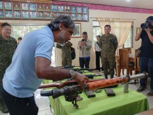 Bukidnon Governor Rogelio Neil Roque inspecting a surrendered NPA RPG launcher at 403rd Brigade headquarters.