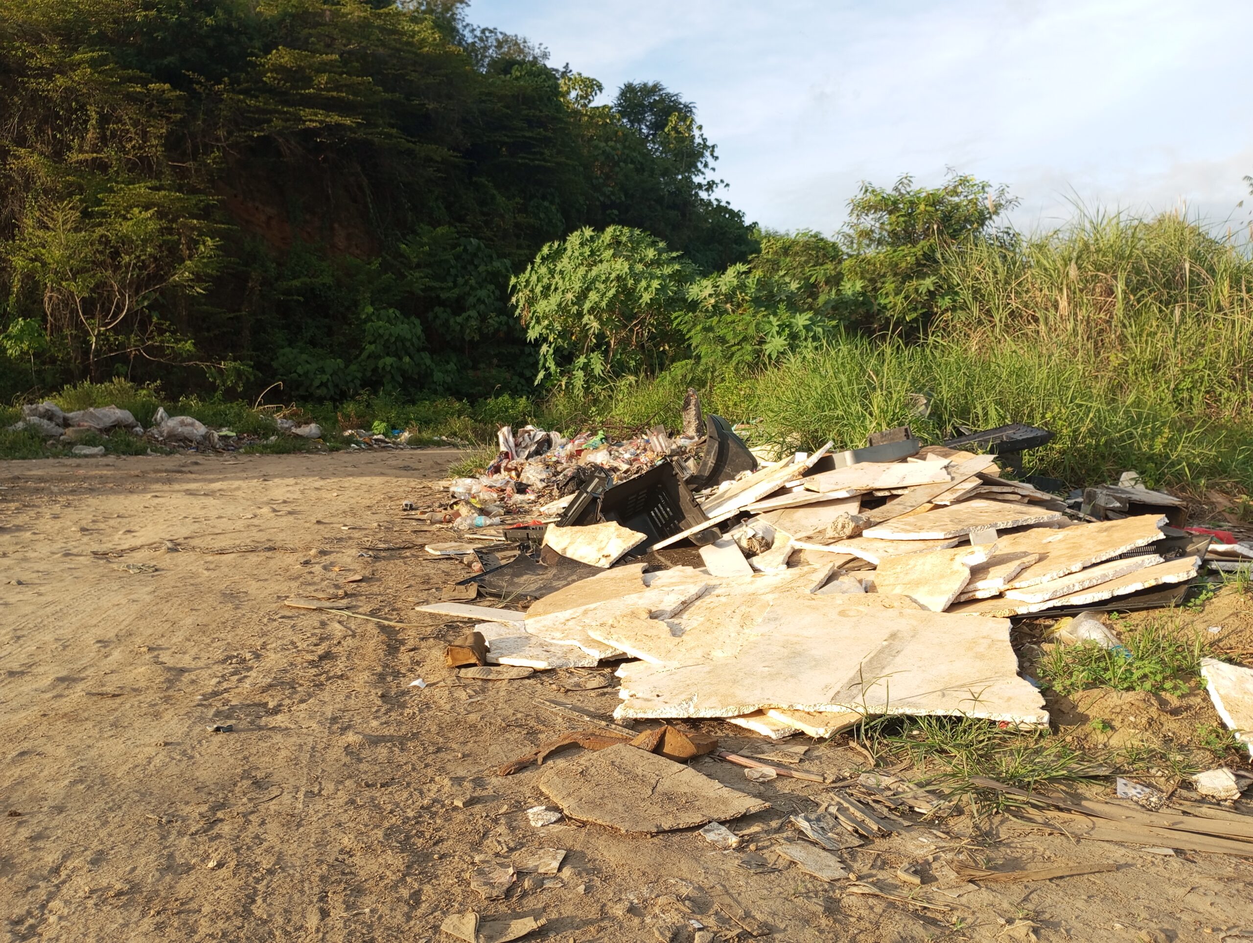 Piles of unregulated garbage and household waste at an illegal dumping site along Bajas Road in Cagayan de Oro City.