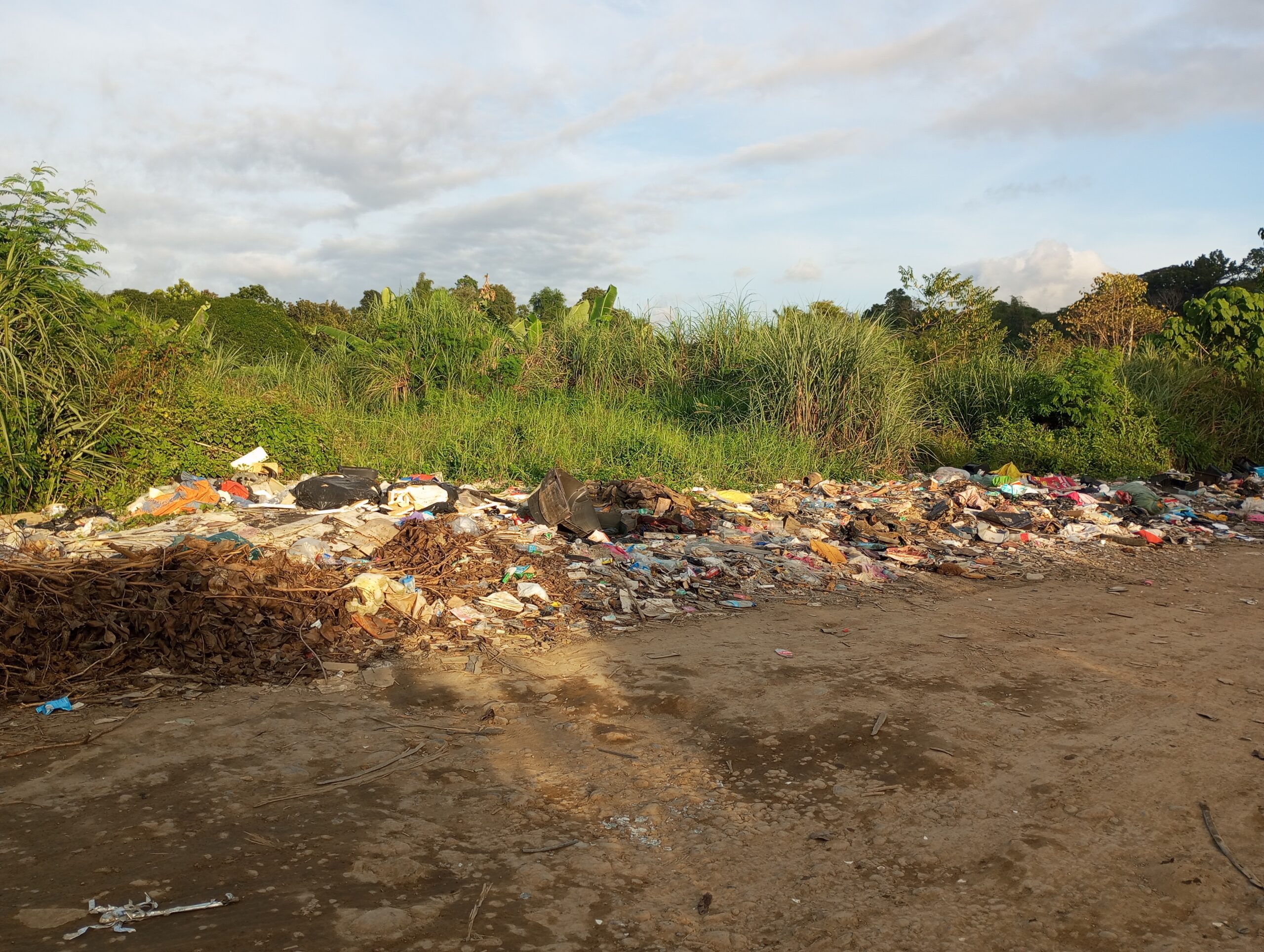 Piles of unregulated garbage and household waste at an illegal dumping site along Bajas Road in Cagayan de Oro City.