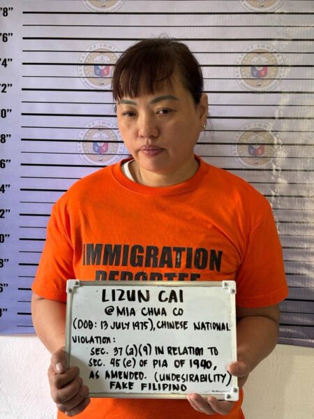 Bureau of Immigration and Philippine Army personnel arresting two Chinese nationals in Iligan City for using fake Filipino identities and violating immigration laws.