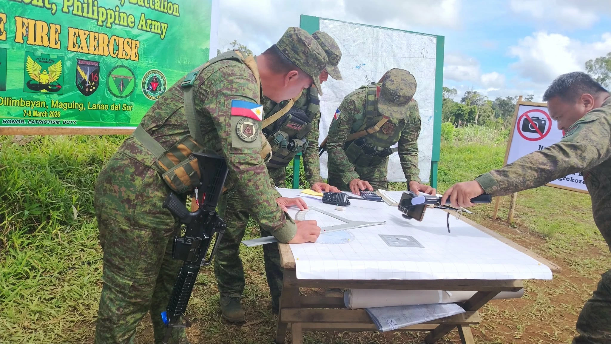 Philippine Army soldiers calculating targeting data for 105mm howitzer operations during Field Artillery Gunnery Proficiency Training (FAGPT) in Tower 88, Maguing.