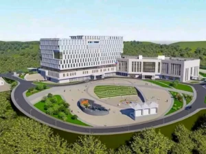 An aerial rendering of the proposed Cagayan de Oro City Government Complex, showing the multi-story executive and legislative buildings, sports facilities, and surrounding commercial spaces at SM Bypass.
