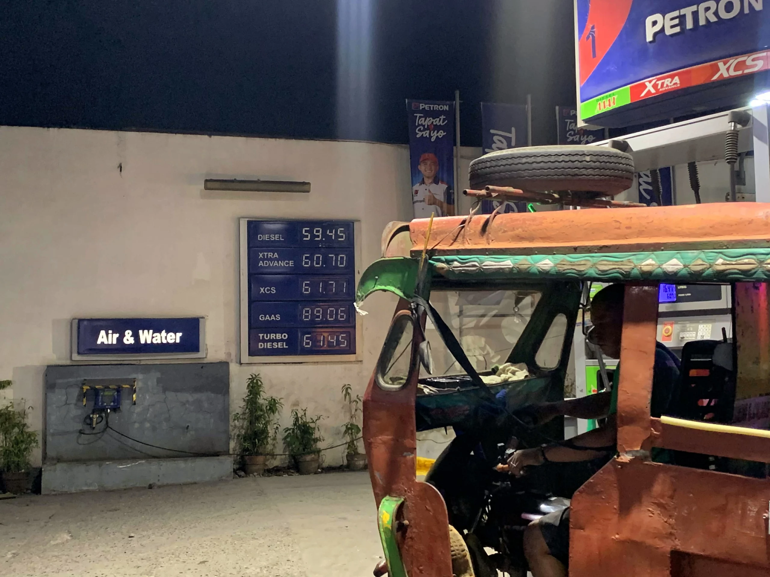 A motorela driver in Barangay Consolacion fueling his vehicle at a Petron station in downtown Cagayan de Oro amid the 4-day workweek shift.