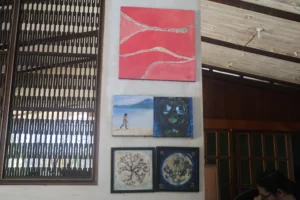 A shaded garden gallery with trees and art displays at Carmen Art District in CDO.