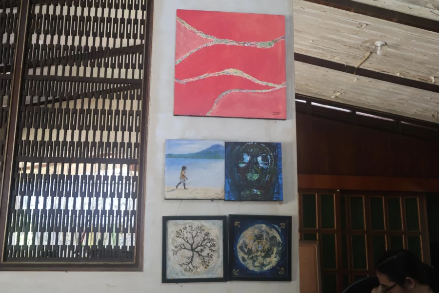 A shaded garden gallery with trees and art displays at Carmen Art District in CDO.