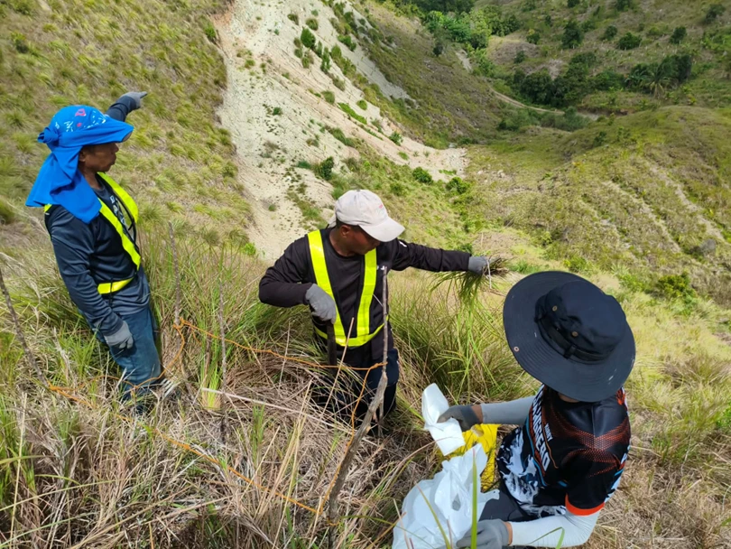 Central Mindanao University researchers collecting understory vegetation and soil litter samples for a carbon mapping project in Misamis Oriental.