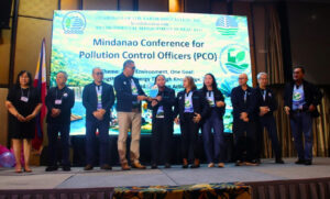 Atty. Noel Tomonglay and Pollution Control Officers from FDC Misamis Power Corporation receiving an environmental compliance award from the Environmental Management Bureau (EMB) Region 10 in Cagayan de Oro City.