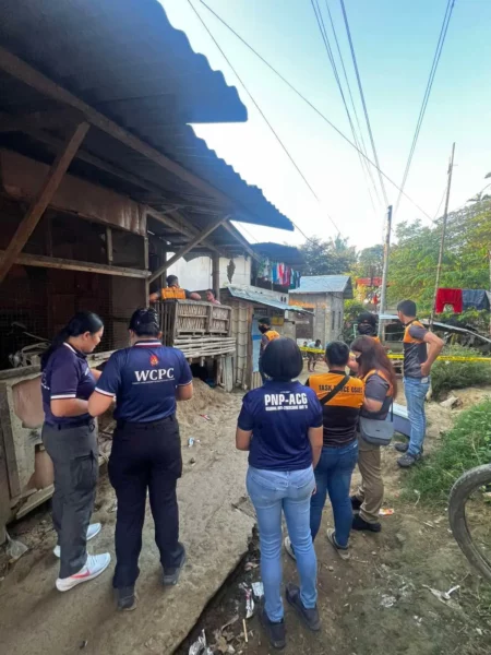 Local and international law enforcement agencies including PAOCC, DOJ-OOC, and UKNCA posing together after an anti-cybercrime operation in Mindanao.