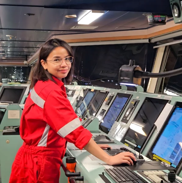 Second Officer KC Abigail Chin-Sood performing watchkeeping duties and drafting passage plans on an international tanker vessel to ensure maritime safety and navigation compliance.