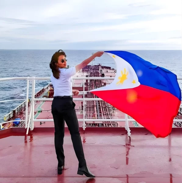 Portrait of Mindanaoan Second Officer KC Abigail Chin-Sood on the bridge of a tanker, highlighting her 12-year career in the male-dominated maritime industry.