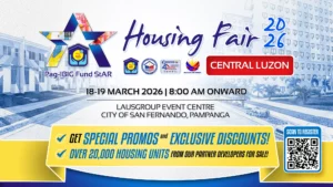Prospective homebuyers inquiring about housing loans at a Pag-IBIG Fund regional housing fair booth.