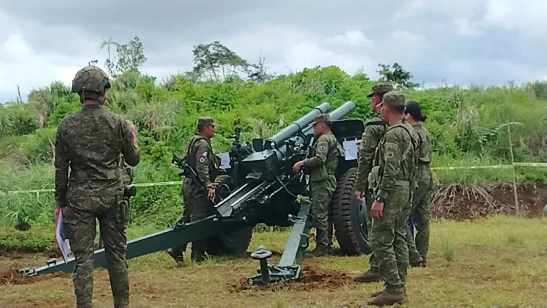 Philippine Army artillery crews operating a 105mm howitzer in Maguing, Lanao del Sur, during the 5th Live Fire Exercise for reservists and regular units.