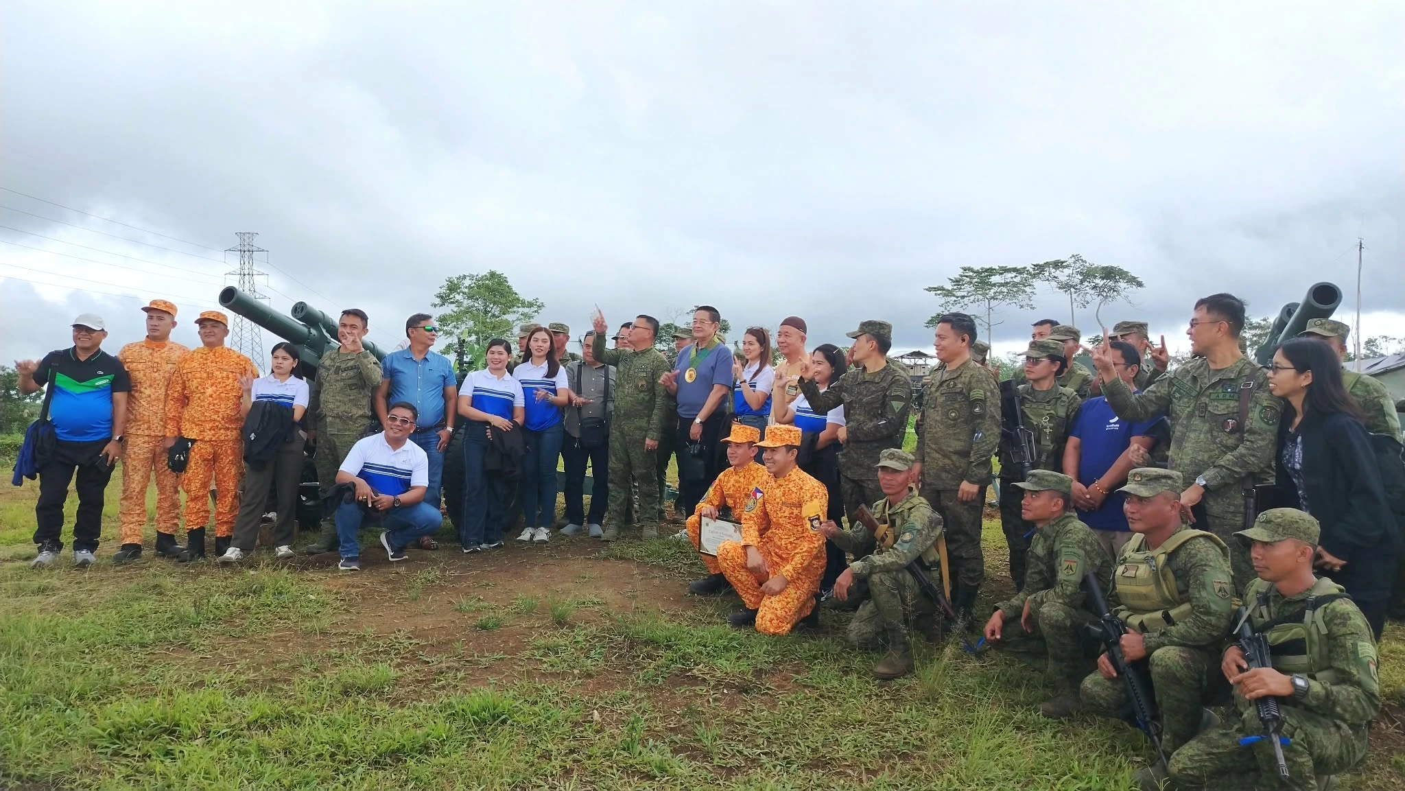 Regular troops and reservists of the 11th Field Artillery Battalion collaborating on a 105mm howitzer during a live fire exercise in Maguing, Lanao del Sur.