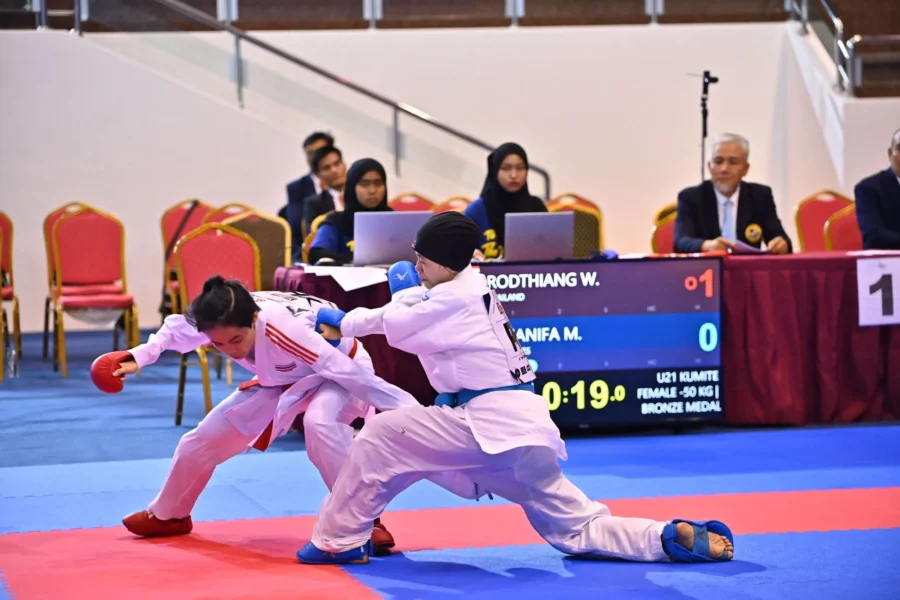 Filipino karateka Princess Juhanifa Minalang from Marawi City, wearing a white karate gi and black hijab, competing on the mat at the 12th Southeast Asia Karate Federation Championships in Brunei.