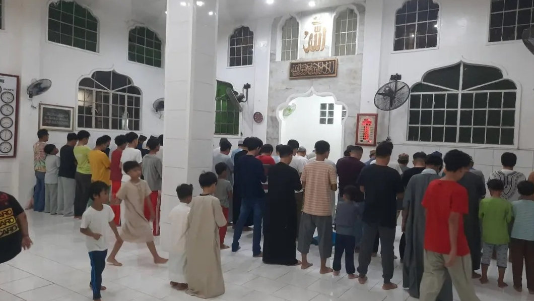 Muslim congregation performing the first Taraweeh night prayer in Naga City, Philippines.