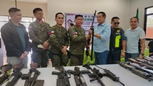 Community members and military officials during the first-ever Small Arms and Light Weapons Management Program turnover in Amai Manabilang, Lanao del Sur.