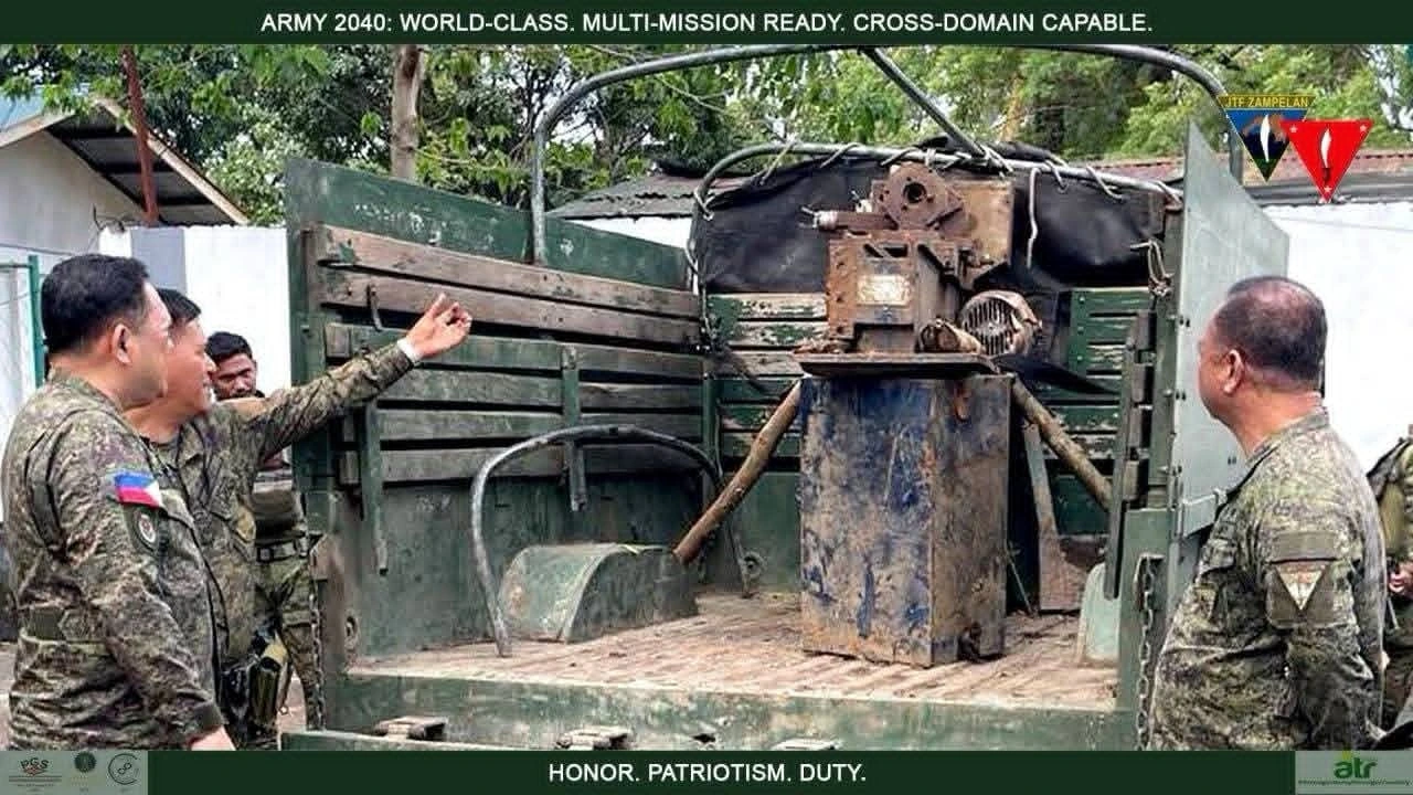 Philippine Army 64th Infantry Battalion troops inspecting seized lathe machines and .50 caliber rifle components at a Maute Group arms factory in Lanao del Sur.