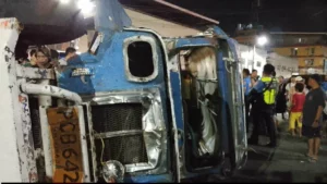 An overturned Patag liner jeepney surrounded by police and bystanders at Cogon Market in Cagayan de Oro City following a fatal accident involving a child.