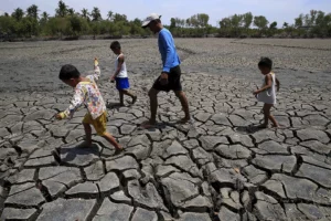 Cracked earth and dry soil in a Mindanao farm during an El Niño dry spell advisory.