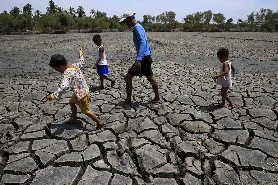 Cracked earth and dry soil in a Mindanao farm during an El Niño dry spell advisory.