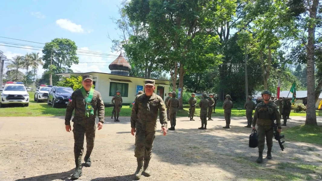 Military personnel and civilian awardees stand with their plaques during the 103rd Infantry Brigade's 52nd anniversary celebration in Marawi City.