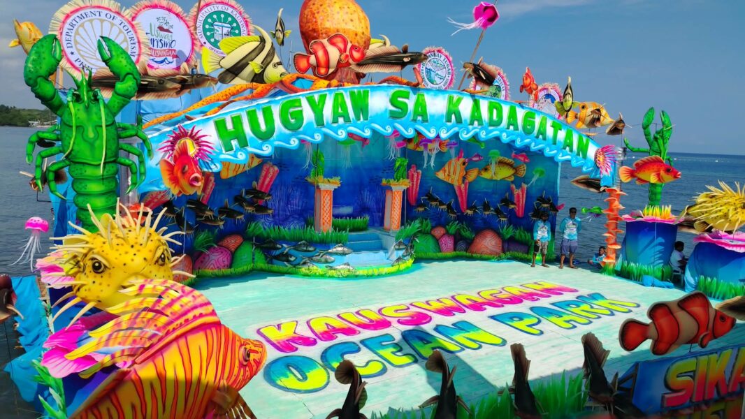 Colorful bamboo rafts known as Gakit with performers in marine-inspired costumes during the Hugyaw sa Kadagatan Festival and Sr. San Vicente Ferrer town fiesta in Kauswagan, Lanao del Norte.