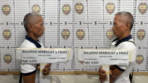 NBI Iligan District Office operatives arresting a wanted rape suspect, Ricardo Mabulay, Mugshot during an NBI clearance application.