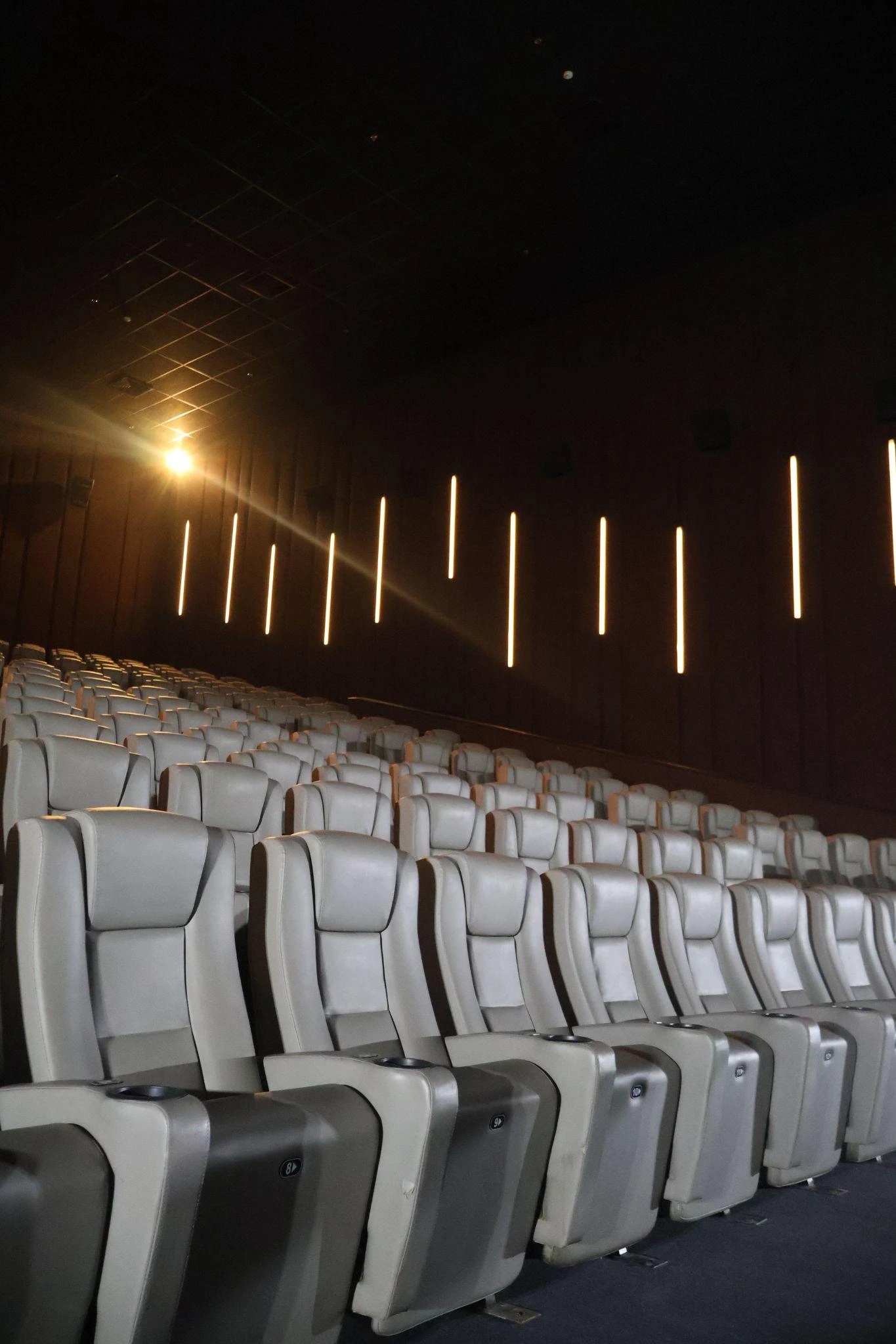 Wide interior view of the newly renovated Cinema 2 at Ayala Malls Centrio, showcasing upgraded ergonomic seating and refined modern decor for Northern Mindanao moviegoers.