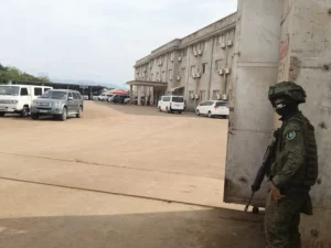 An armed soldier standing guard at the main entrance gate of the Philippine Sanjia Steel Corporation facility in Tagoloan, Misamis Oriental.