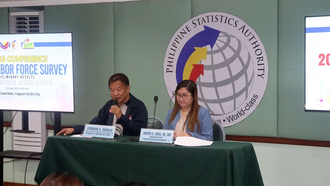 DOLE-10 Technical Support Services Division Chief Atheneus A. Vasallo speaking into a microphone alongside PSA-10 Regional Director Dr. Janith C. Aves at a labor force survey press conference table.