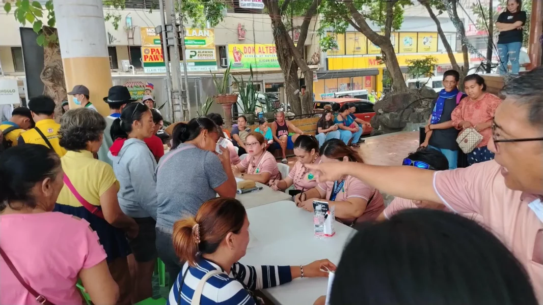 Hundreds of residents queuing at dawn at Iligan City Public Plaza for the P20 per kilo Benteng Bigas program.