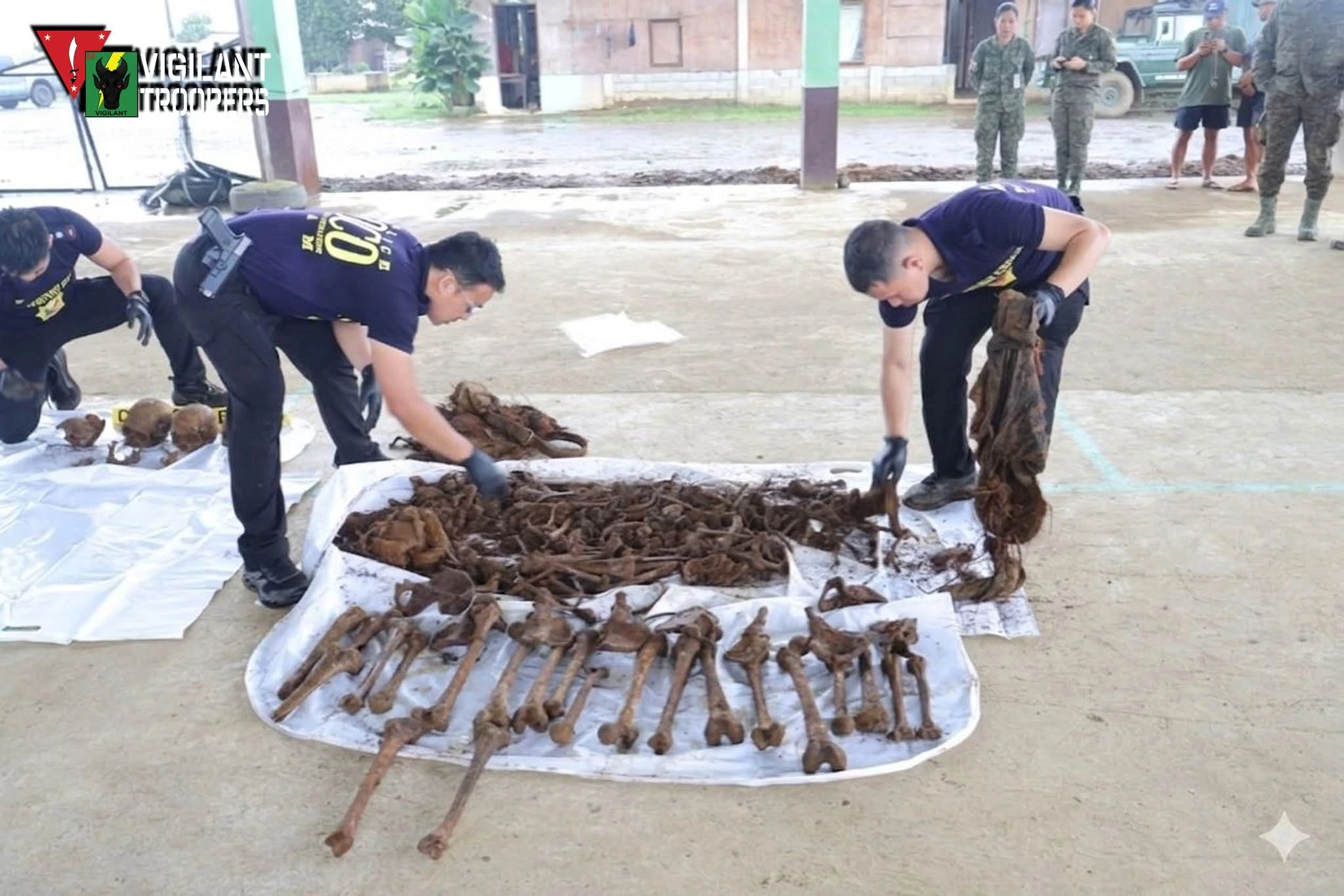 Joint military and police operatives exhuming skeletal remains in Barangay Dilimbayan, Maguing, Lanao del Sur.