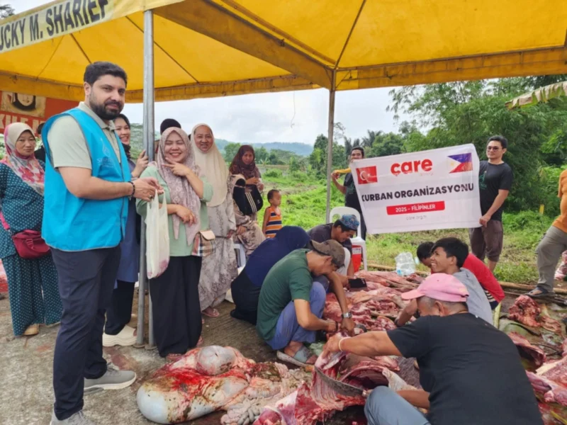 Volunteers from the Turkish Filipino Friendship and Solidarity Association distributing fresh cattle meat package donations to local residents in Lanao del Sur.