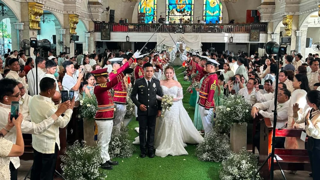 Couples exchange vows during a mass wedding ceremony at St. Michael's Cathedral in Iligan City.