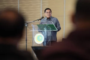 Bangsamoro Chief Minister Abdulraof Macacua speaking into a microphone during a press conference at the Bangsamoro Government Center.