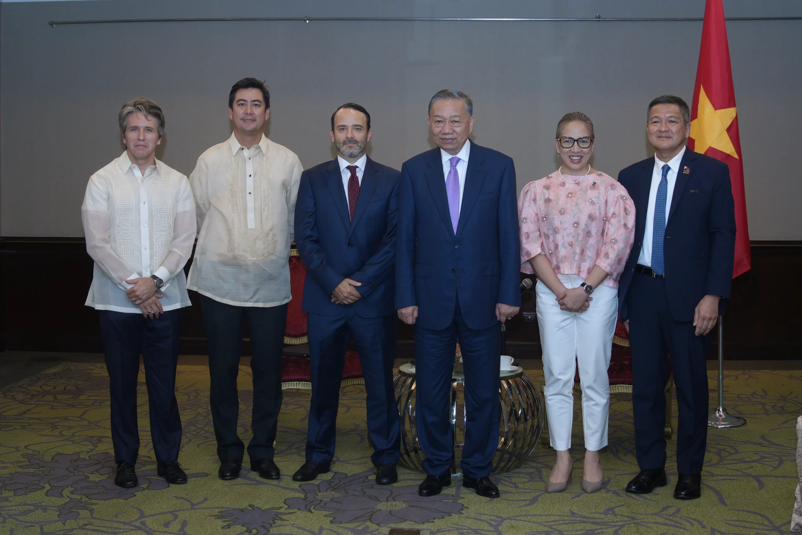 Aboitiz Group executives Carlos Aboitiz, Sandro Aboitiz, Tristan Aboitiz, Cosette Canilao, and DJ Sta. Ana stand with Vietnamese President To Lam during his state visit to the Philippines.