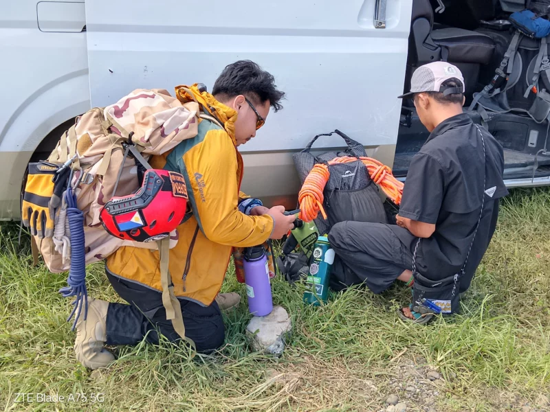 An 11-member volunteer search and rescue team checks their equipment and gear in Pangantucan, Bukidnon, on Wednesday, June 17, 2026, before deploying into the Mt. Kalatungan forest to search for missing hiker Alkharj Zamayla