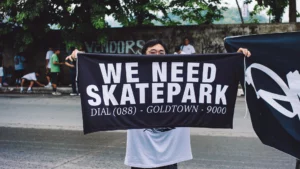 A group of local youth skateboarders parade down the concrete roads of Paseo del Rio and Rio de Oro Boulevard during an organized sports demonstration.