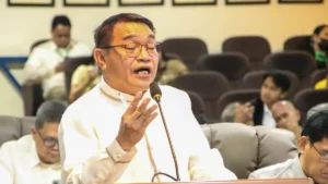 Cagayan de Oro City Councilor Marlo Tabac speaks at the podium during a regular City Council session regarding campus police visibility.