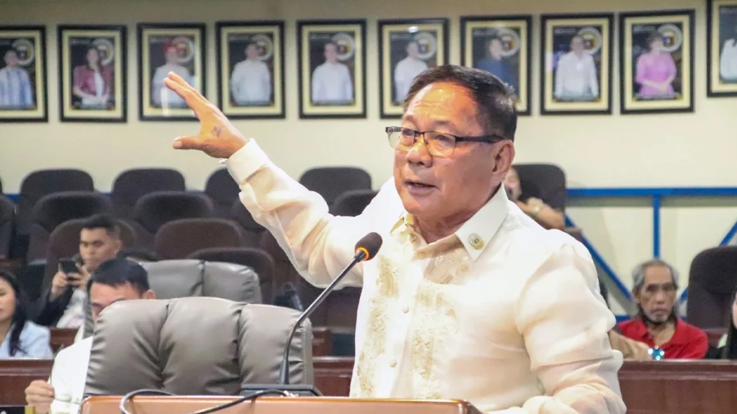 Cagayan de Oro City Councilor Roger Abaday speaking at a podium and gesturing during a City Council session regarding the COWD water rate increase.