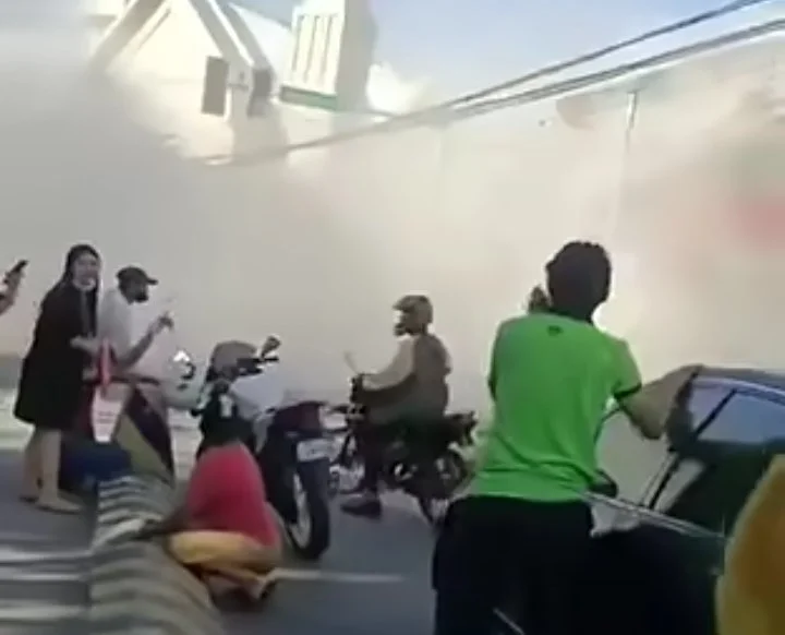 Interior of a fast-food restaurant in General Santos City covered in thick dust and fallen ceiling debris following a magnitude 7.0 earthquake.